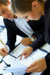 People Viewing Documents Image